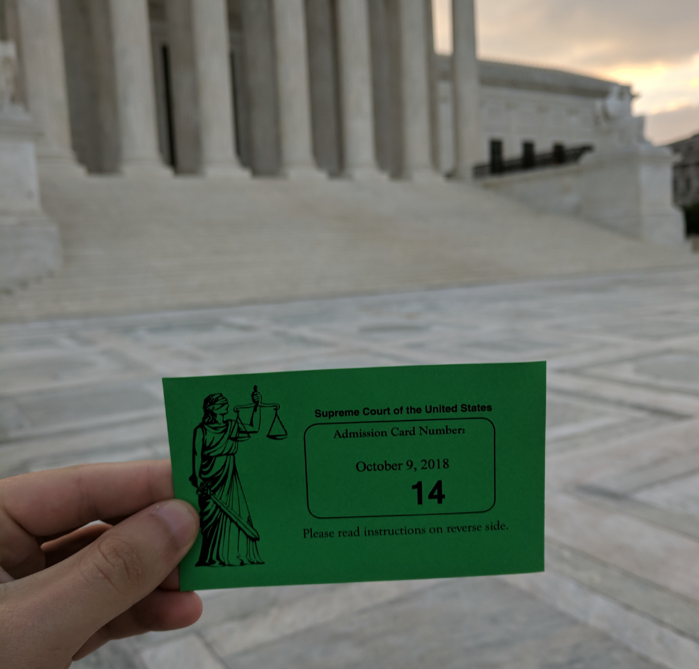 A picture of a ticket granting entry to the U.S. Supreme Court chambers for oral arguments before the court.