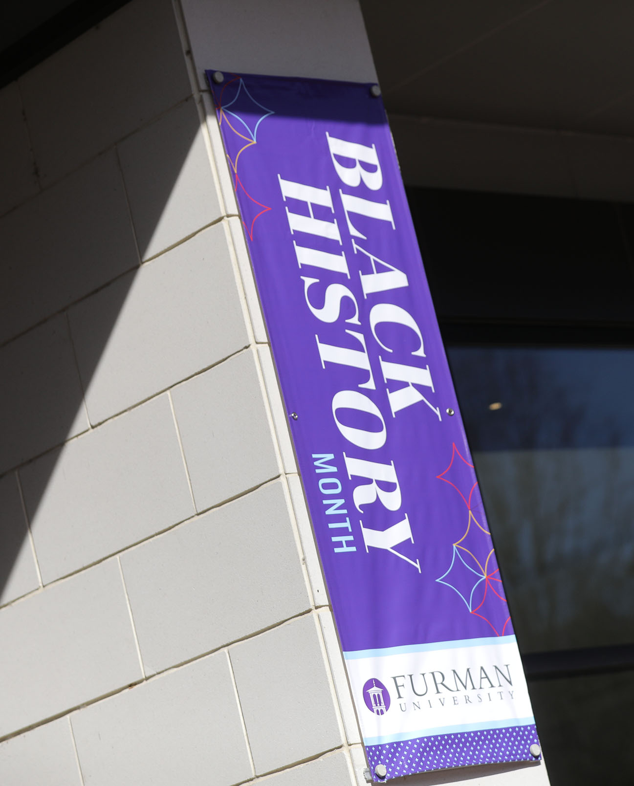 A Black History Month banner hanging at the Trone Student Center