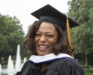 Black woman in graduation regalia