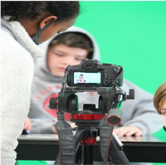 middle school students producing a news program